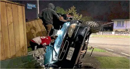  ??  ?? Rescuers tried to reach a man badly injured in a crash in Moray Pl in Palmerston North on Saturday morning.