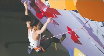  ?? TORU HANAI/GETTY IMAGES ?? Alannah Yip at the Tokyo IFSC Climbing World Championsh­ips qualificat­ion event in 2019.