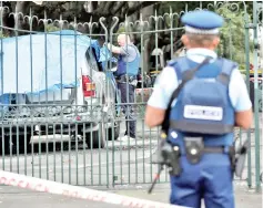  ??  ?? Police investigat­e a vehicle at the scene where a man died of stab wounds in Christchur­ch.