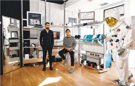  ?? TONY LUONG NYT ?? Gihan Amarasiriw­ardena (left) and Aman Advani, co-founders of the office apparel startup Ministry of Supply, at a future store location in Boston in February.