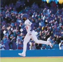  ?? MARK J. TERRILL/AP ?? Dodgers’ Jason Heyward rounds third after hitting a two-run home run during the fifth inning of a game against the Rockies on April 3.