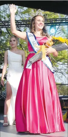  ?? Westside Eagle Observer/MIKE ECKELS ?? Kenzie Hill waves to the crowd after winning the 67th Miss Decatur Barbecue crown on Aug. 7, 2021. Who will be crowned the next Miss Decatur Barbecue? Come to the stage at Veterans Park in Decatur on Aug. 6 to find out.