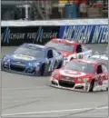  ?? PAUL SANCYA — THE ASSOCIATED PRESS ?? Kyle Larson (42) restarts next to Chase Elliott (24) on his way to winning the NASCAR Sprint Cup Series auto race at Michigan Internatio­nal Speedway, in Brooklyn, Mich., Sunday.