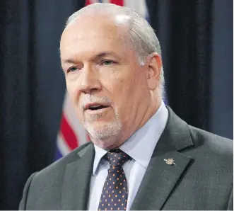  ?? CHAD HIPOLITO/THE CANADIAN PRESS ?? If British Columbia Premier John Horgan is successful in blocking the Trans Mountain pipeline expansion, Alberta is expected to take a credit rating hit, warns Moody’s Investors Service.