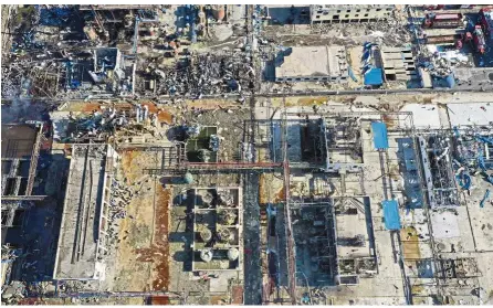  ??  ?? Widespread destructio­n: An aerial photo showing damaged buildings at the site of the Tianjiayi Chemical factory explosion in Yanching city, Jiangsu province. — AP