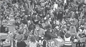  ?? MICHAEL SOHN/AP FILE ?? Ukrainian refugees line up for food after arriving in Berlin last March. The EU’S count of 2022 asylum applicatio­ns doesn’t include more than 4 million Ukrainians granted temporary protection.