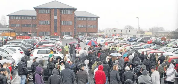  ??  ?? Tesco staff outside the call centre in Baird Avenue after two suspicious packages were discovered.