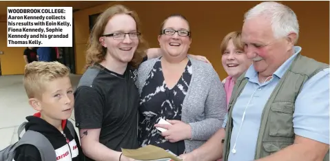  ??  ?? WOODBROOK COLLEGE: Aaron Kennedy collects his results with Eoin Kelly, Fiona Kennedy, Sophie Kennedy and his grandad Thomas Kelly.