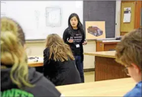  ?? CHRISTINE WOLKIN — FOR DIGITAL FIRST MEDIA ?? Kristine Loh, outreach director for the Society of Women Engineers at Drexel, teaches girls how to create a breadboard during the Engineerin­g Night for Girls program on Tuesday night, Feb. 8, at North Penn High School. Kristine Loh is a second-year...