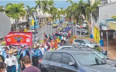  ?? Picture: ELISABETH CHAMPION ?? SUPPORT: The Remembranc­e Day march down Fitzgerald Esplanade, Innisfail yesterday.