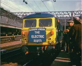  ?? HUGH DOUGHERTY ?? On Monday, May 6, 1974, Class 87 No. 87015, complete with Electric Scots headboard, attracts plenty of attention at the head of the first Down Royal Scot at Glasgow Central’s Platform 2, as it waits to leave for Euston, due five hours later.