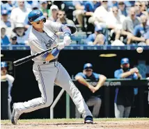  ?? THE ASSOCIATED PRESS ?? Toronto’s Troy Tulowitzki hits a solo home run during the second inning against the Kansas City Royals on Saturday.