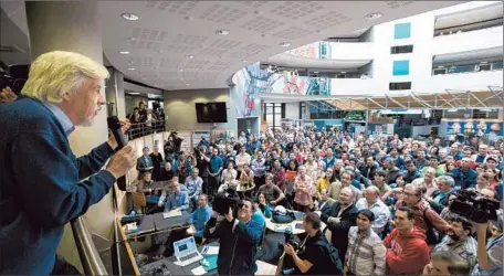  ?? Salvatore Di Nolfi Associated Press ?? CERN DIRECTOR GENERAL Rolf-Dieter Heuer and his staff celebrate the news of the Nobel Prize winners at the lab near Geneva.