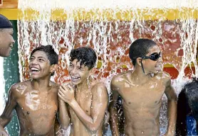  ?? Helen H. Richardson, Denver Post file ?? From left, Maurice Martin, Jayden Michael, Isaac Alvirde and AJ Vegas cool off at the Mestizo-curtis pool in July 2020.