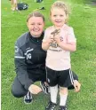  ??  ?? Dryburgh Girls U/9 Lisa Evans Centre Trainer of the Week is Lyla Ironside pictured with Danielle Geekie.