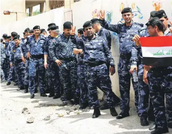  ?? EPA ?? Members of the security forces wait to cast their early votes in Baghdad