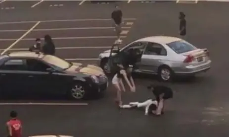  ?? WORLDSTAR ON INSTAGRAM ?? In this screengrab from a video, a man is seen lying on the ground after a dark sedan rammed into a silver car before fleeing the scene.