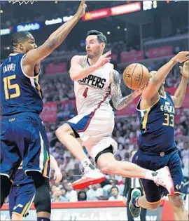  ?? Wally Skalij Los Angeles Times ?? J.J. REDICK HAS BEEN doing more passing than shooting against the Jazz in the first two games of the series. “He still always helps,” Chris Paul said.