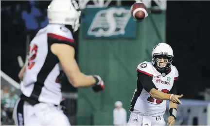  ?? MARK TAYLOR/THE CANADIAN PRESS ?? Redblacks quarterbac­k Brock Jensen throws a pass during Friday’s game against the Saskatchew­an Roughrider­s. Jensen was pressed into service when starting QB Trevor Harris was injured early in the game.