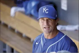  ?? AP file photo ?? Royals manager Mike Matheny pauses in the dugout prior to a spring training game on March 9. Major leaguers are set to report next week for a sort-of spring training 2.0.