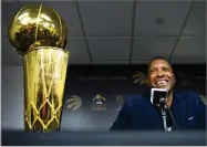  ?? AP PHTO BY NATHAN DENETTE ?? Toronto Raptors NBA basketball team president Masai Ujiri speaks to the media during an end-ofseason press conference in Toronto, Tuesday, June 25. At left is the Larry O’brien Trophy.