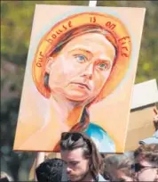  ??  ?? FRANCE: A banner depicting activist Greta Thunberg in Paris.
REUTERS