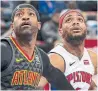  ?? DAVE REGINEK GETTY IMAGES ?? The Hawks’ Vince Carter and Pistons’ Bruce Brown battle for position Sunday.