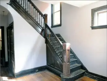  ?? Nate Guidry/Post-Gazette photos ?? A view of the front staircase inside this home in Marshall-Shadeland.