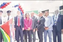  ?? ?? flag) and his co-pilot Alan Brooks flanked by United Foreign, Commonweal­th, & Developmen­t Office, David , British High Commission­er Jane Miller, and St Lucia t Hilaire, along with other officials.