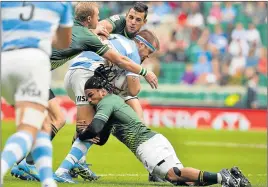  ?? Picture: GALLO IMAGES ?? NO GUARANTEES: South Africa’s Rosko Specman and Chris Dry tackle Fernando Luna of Argentina. Specman and Dry are in the preliminar­y World Cup squad, but will have to prove their fitness and form after missing the latter stages of the 2017-18 World...