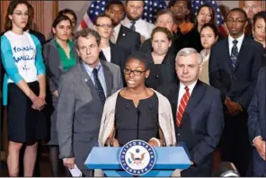  ?? AP/J. SCOTT APPLEWHITE ?? Howard University political science major Clarise Mccants, joined by Democratic Sens. Sherrod Brown (left) of Ohio and Jack Reed of Rhode Island, on Tuesday in Washington urged Congress not to double student-loan interest rates. “I know I’m not the...