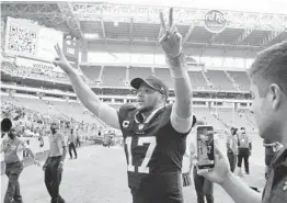  ?? HANS DERYK/AP ?? Quarterbac­k Josh Allen heads to the locker room after the Bills’ 35-0 road win over the Dolphins on Sunday. The Bills evened their early-season record at 1-1.