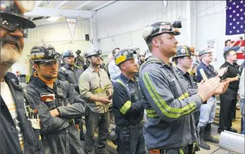  ?? Nate Guidry/Post-Gazette photos ?? Coal miner Greg Bernot, left, who grew up in Carmichael­s, and others listen Thursday as U.S. EPA Administra­tor Scott Pruitt addresses miners at the Harvey Mine in Sycamore.