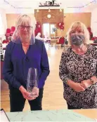  ??  ?? Current President Joy Critchlow (left) and secretary Jane Fleet with the engraved vase.