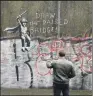  ??  ?? ARTWORK: Scott Street Bridge in Hull has become a tourist attraction for its Banksy mural.