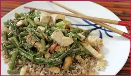  ?? PHOTO BY CURT NORRIS ?? Chicken Tenders and Asparagus Stir-Fry is a dish that requires very little time to cook once the ingredient­s are assembled.