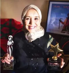  ??  ?? Baibanou is pictured in her home with her trophies in the Sidi Moussa district of Sale near Rabat. — AFP photo