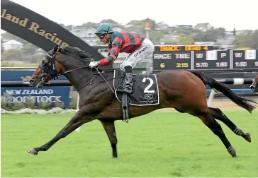  ?? TRISH DUNELL ?? Dragon Leap and Opie Bosson stride clear to take out the Group II Avondale Guineas (2200m) at Ellerslie yesterday.