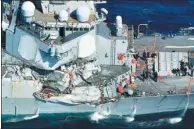  ?? KYODO VIA REUTERS ?? The heavily damaged US Navy guided-missile destroyer Fitzgerald limps back to port off Shimodo, Japan, on Saturday after colliding with a Philippine-flagged container ship. Seven sailors were killed.