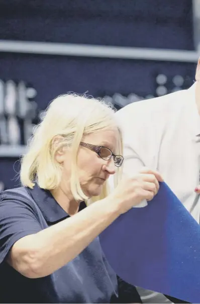  ??  ?? 0 Theresa May meets factory workers at Scottish Leather Group In Bridge of Weir during her trip north of the Border yesterday. It was the latest stop on her nationwide tour to sell her plan to the people