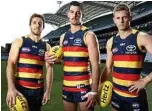  ?? PHOTO: SARAH REED/NEWS CORP ?? GAME FACES: Crows players Richard Douglas, captain Taylor Walker and David McKay are ready to face Geelong tonight.