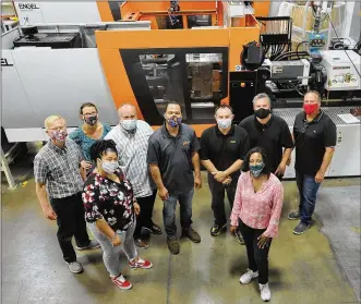  ?? MARSHALL GORBY PHOTOS / STAFF ?? The production team at PVS Plastics Technology Corp. in Huber Heights, from left to right in the front row: Karrene Wright and Jody Williams. Back row: Rich Tursic, Angela Acker, Chad Terrill, Ralph Green, Ben Geyer, Mark Daye and Tony Rockas.