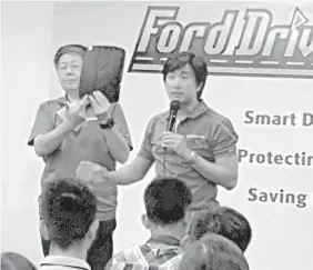  ??  ?? JP Tuason, head of Tuason Racing School, discusses safe practices in driving to about 300 drivers in the Ford Driving Skills for Life Seminar held in SM City Cebu Trade Hall.