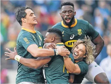  ?? /Anton Geyser/Gallo Images ?? Flying start: Aphiwe Dyantyi, second left, celebrates with teammates Franco Mostert, left, Siya Kolisi and Faf de Klerk after scoring a try after 30 seconds against Australia. Dyantyi went over twice in the win against the All Blacks in Wellington and will be hoping to continue the sequence at Loftus on Saturday.