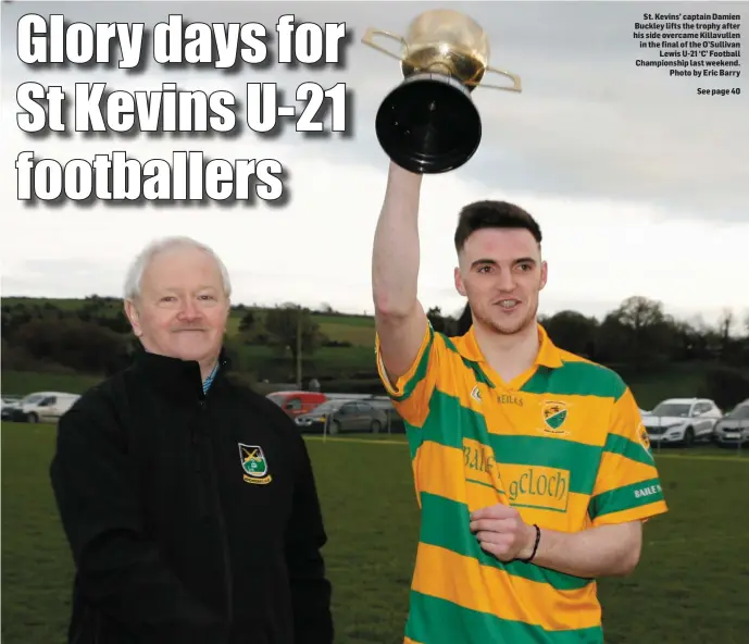  ??  ?? St. Kevins’ captain Damien Buckley lifts the trophy after his side overcame Killavulle­n in the final of the O’Sullivan Lewis U-21 ‘C’ Football Championsh­ip last weekend. Photo by Eric Barry