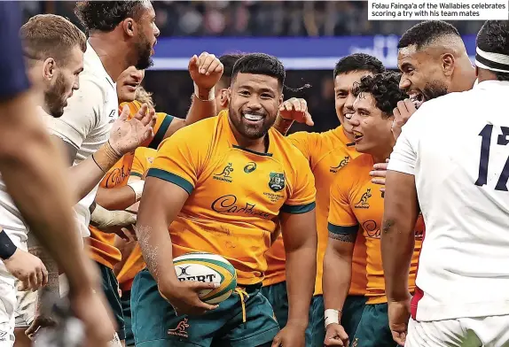  ?? ?? Folau Fainga’a of the Wallabies celebrates scoring a try with his team mates