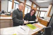  ?? NWA Democrat-Gazette/J.T. WAMPLER ?? Jennifer Sharpshair, deputy county clerk, helps John Brooks (left) of Fayettevil­le on Tuesday file to run for District 2 constable at the Washington County Courthouse in Fayettevil­le. Tuesday was the last to file the paperwork to run for public office.