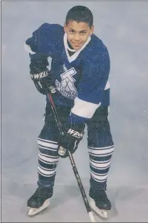  ??  ?? Harris, at 11, playing for the Steinbach Millers in 1998- 99