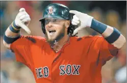  ?? ELISE AMENDOLA/AP PHOTO ?? Jarrod Saltalamac­chia gestures to the dugout after hitting a tie-breaking grand slam in the seventh inning to lift the Red Sox to an 8-4 victory over the Yankees on Friday night at Fenway Park.