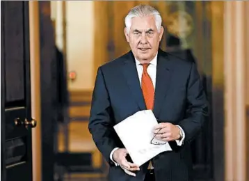  ?? WIN MCNAMEE/GETTY ?? Secretary of State Rex Tillerson denies resignatio­n reports during a statement Wednesday at the State Department.